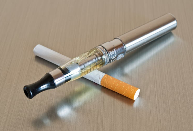 Vaping pen and cigarette
